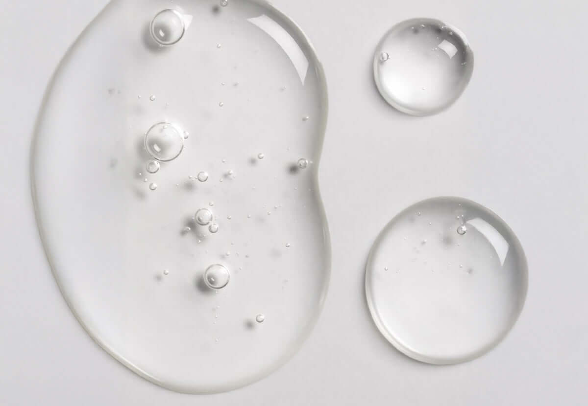 Close-up of creamy skincare texture with ceramide molecules, symbolizing barrier repair and moisture lock