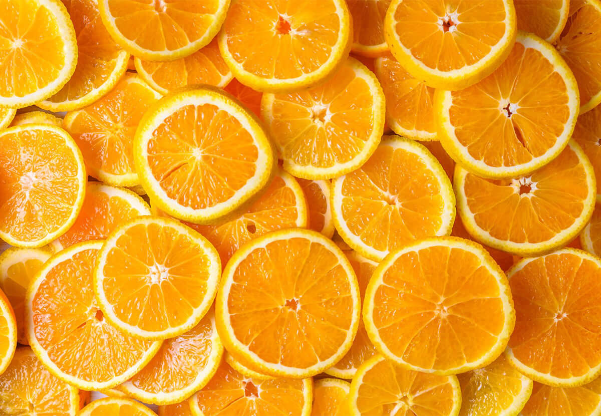 Fresh orange slices, representing vitamin C’s brightening and antioxidant benefits