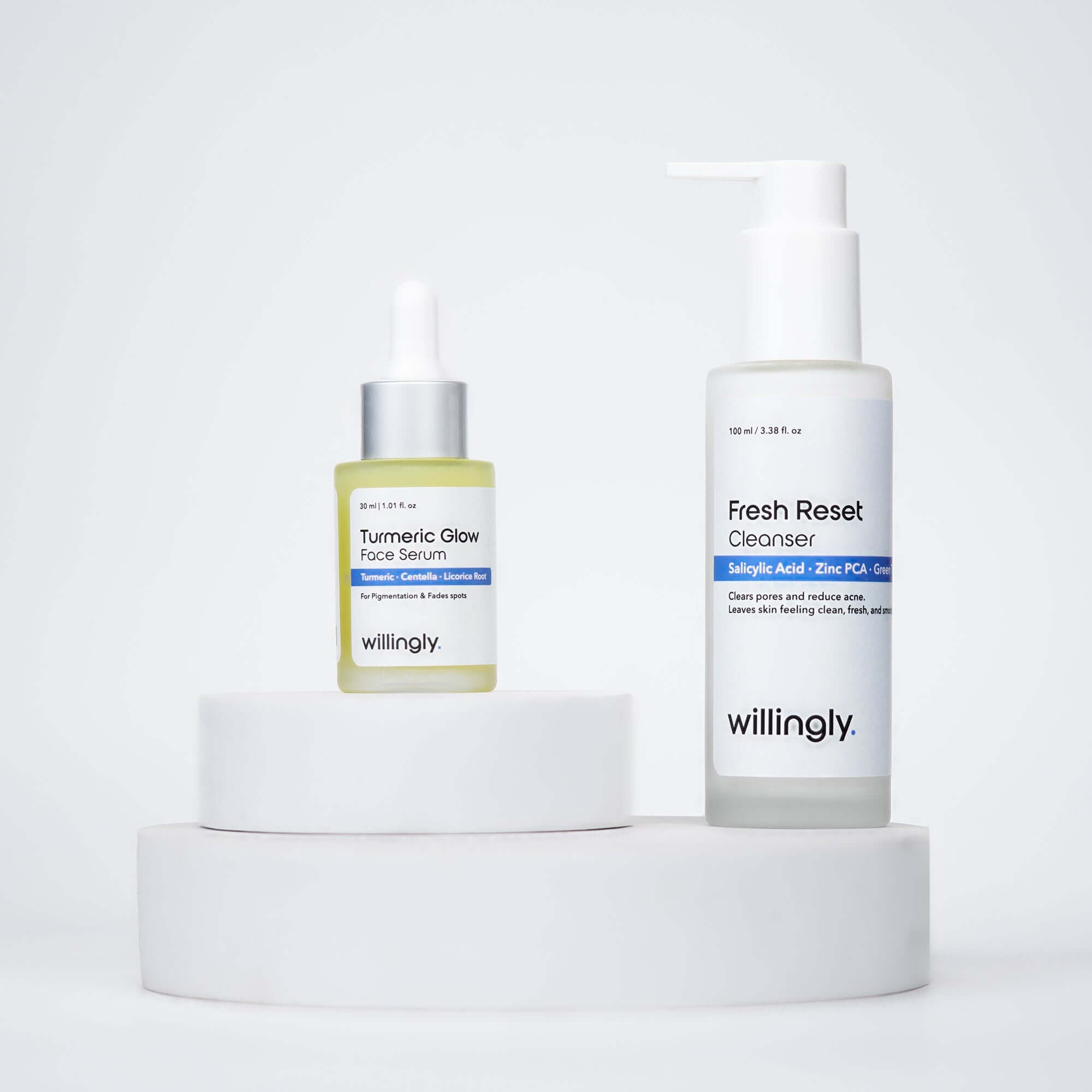 Willingly Clear & Calm Duo with Fresh Reset Cleanser and Turmeric Glow Serum on white marble display