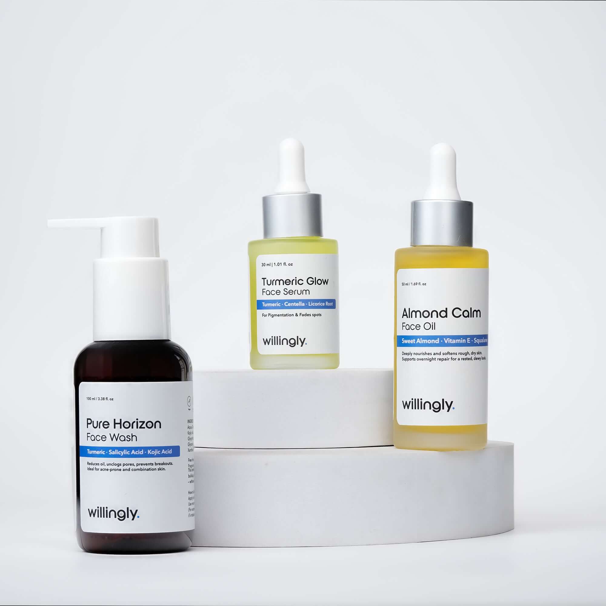Willingly Radiance Calm Set with Pure Horizon Face Wash, Turmeric Glow Serum, and Almond Calm Face Oil on white marble display